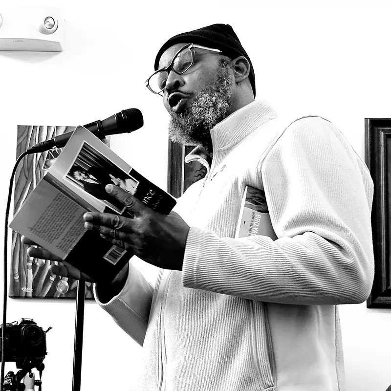 Yao Glover reading at the museum